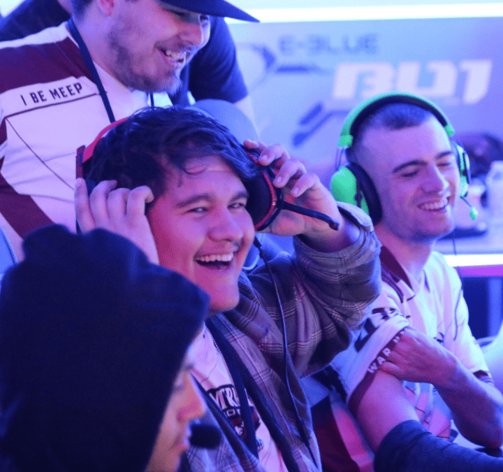 McMurry esports players smiling at gaming stations
